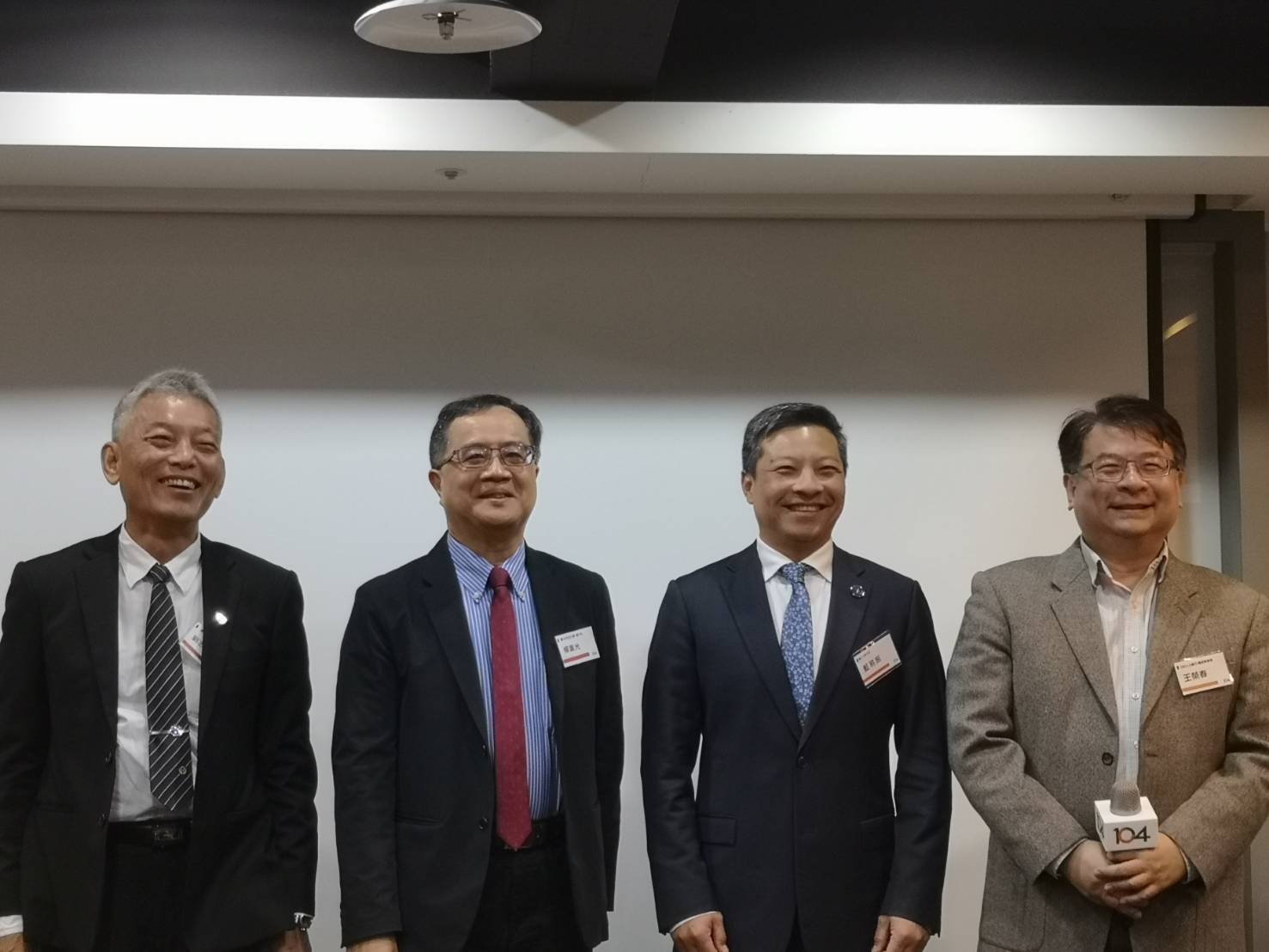 The photo features distinguished guests from left to right: Vice President Ji-Cheng Liu of Taiwan Tech, Vice President Chung-Kuang Yang of National Taipei University of Technology, President Yi-Chen Lan of Fu Jen Catholic University, and Rong-Chun Wang, Career Education Director of 104 Job Bank.